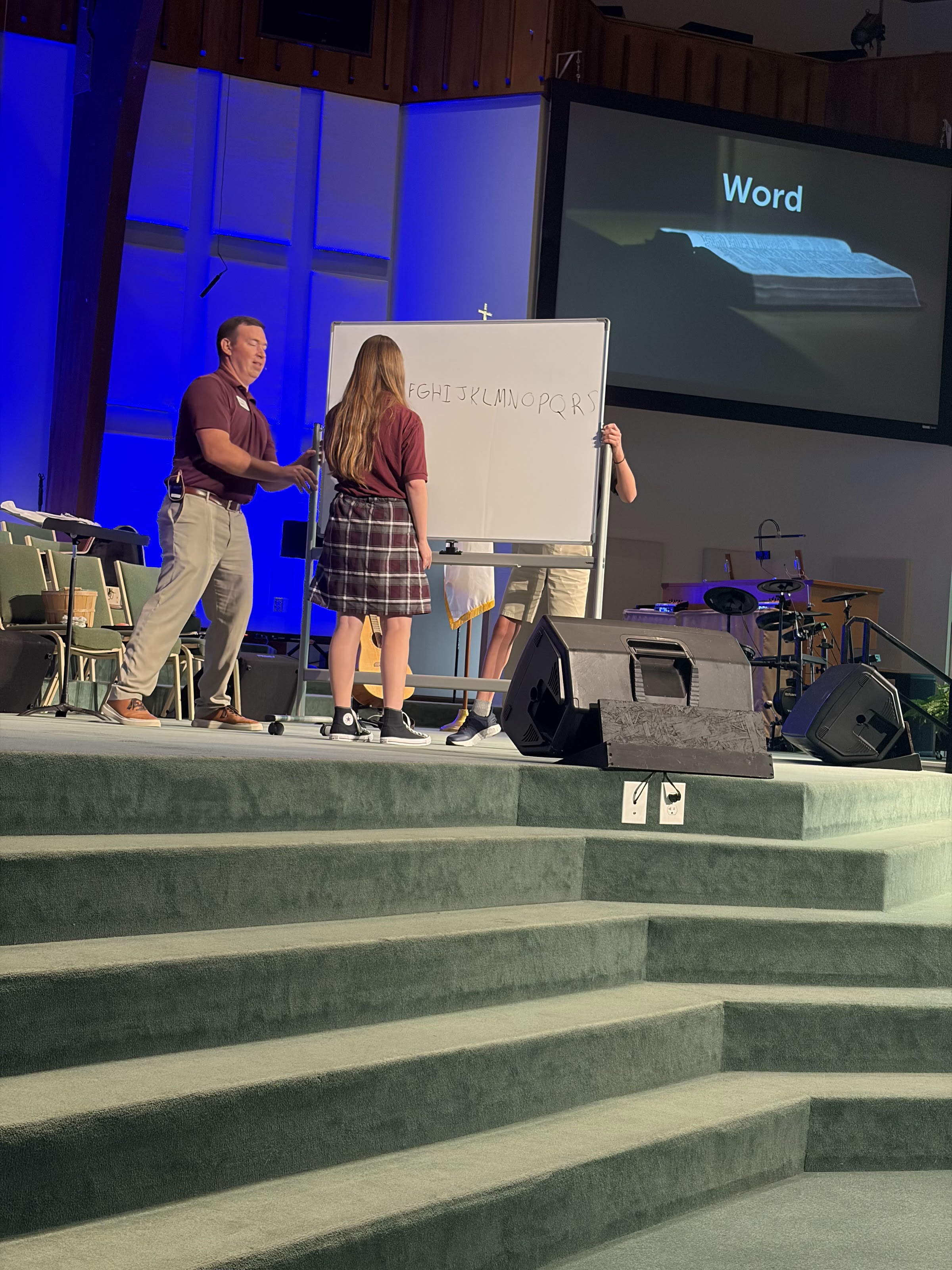A BCA student on stage during chapel