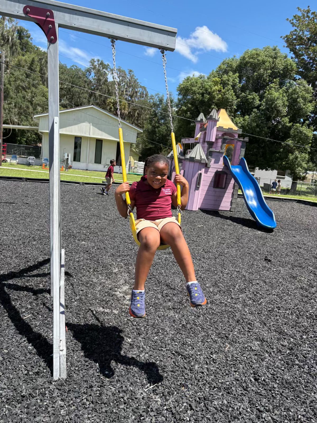 A young student on the swings